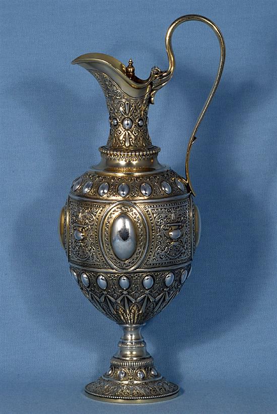 A mid Victorian parcel gilt silver ovoid shaped wine ewer/ claret jug, Height 13 ½”/340mm Weight 23.oz/653grms